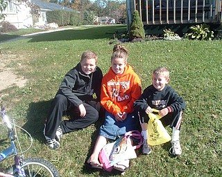Brooke, Carson and Jackson Lambert waiti on the grass for the Mineral Ridge Parade on Route 46 in October. Photo sent by their mother, Julie Lambert.