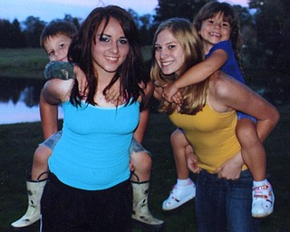 Rachael Morris with Paul VanAuker and Leanna Hartsough with Isabelle Cressinger. Photo from Lana VanAuker of Canfield.