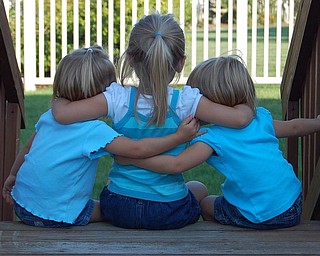 Sally Jones of Canfield caught this moment in August as her daughters, Allison, 3; Samantha, 4; and Lindsay, 3, sat outdoors.