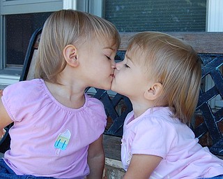 Sally Jones of Canfield took this shot of her twin daughters "smooching" in May, 2007. They're Allison and Lindsay, both 2.