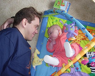 Uncle Jason Mitchell meets Emma Petkosh for the first time. Emma, 4 months, is the daughter of Cara and Gordon Petkosh of Olmsted Falls, Ohio. Jason Mitchell visited from Seattle with his wife, Kimberly for Thanksgiving last week. Loren and mag Mitchell of Canfield, Emma's grandparents, submitted the photo.