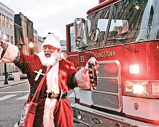 Santa is brought in by Youngstown Fire Department during the Christmas Tree lighting in downtown Youngstown, Friday December 5, 2008