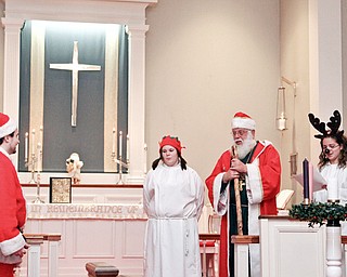 ST. NICHOLAS FESTIVAL: Participants in “A Festival Eucharist” at St. James Church donned festive costumes for the St. Nicholas Day Festival. The event was Saturday. They are, from left, Zeke Coughlin, Jamie Vanden Bosch, William Dick and Lydia Scheel. The festival Eucharist celebrates the life of Nicholas, bishop of Myra and patron saint of children.