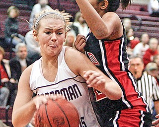 MOVING FORWARD: Boardman's Kayleigh Lipke pushes by Anokha Padubidri of Canfield during the first-half action of Saturday's game in Boardman. The Spartans defeated the Cardinals, 51-42.