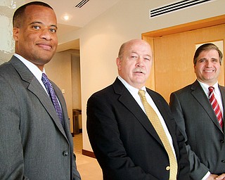 EXPANSION INCENTIVE: Posing in Columbus on Monday after a talk are, from left, Youngstown Mayor Jay Williams; Roger Lindgren, president of manufacturer V&M Star Steel; and GIrard Mayor James Melfi. Youngstown and Girard have offered incentives to V&M Star, which borders the cities, if it chooses to expand in that area.