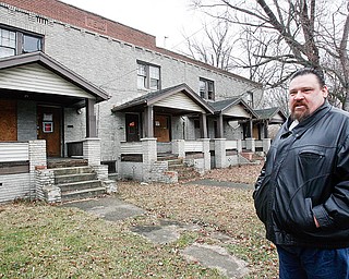 James London outside The empty six plex at 1002 -1006 Parkview in Youngstown on the demolition list part of Mark King Properties