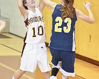 SOUTH RANGE - UNITED - (10) Mackenzie Pfeifer of South Range looks to make a play as (23) Sierra Parks plays defense Thursday in South Range.
