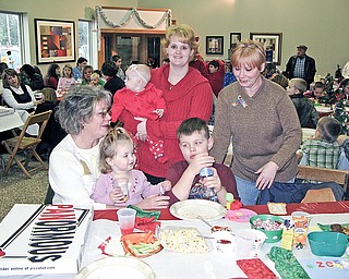 FAMILY SUPPORT: The Nosek family of Berlin Center attends the holiday party for The RIch Center at Weather Tite Windows in Liberty. The family thanks the center for helping 7-year-old Caden Nosek, who has an autism spectrum disorder, learn to better communicate. Standing are mother Kimberly Nosek, holding her daughter Avrie, and relative Gale Saunders. Sitting in front of them are Becky Burnett, holding her granddaughters Zoey, and Caden.