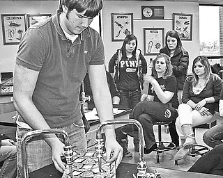 <p>Special to The Vindicator</p>
<p>IT&#8217;S A WRAP: Students from area high schools, who will be volunteer gift-wrappers during a Jewish Community Center gift-wrap fundraiser on Dec. 24 at the Southern Park Mall, watch as Brendan Paull of Boardman High School demonstrates the gift-wrapping technique he learned during the past two weeks in preparation for the fundraiser.</p>