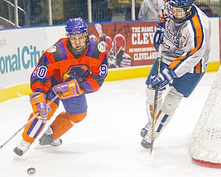 Phantoms Stefan Salituro moves the puck past Kevin Gibson of the Rangers during 12/20/2008 game.