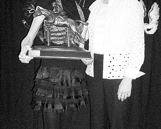 Gina Malito of Howland poses with Karen O'Connor, a U.S. Olympian in equestrian events. Malito is holding the trophy that will bear her name and the name of the pony she rode while winning first place in her division of events sponsored by the United States Eventing Association. Malito and her pony won two national awards for their performances in 2008.