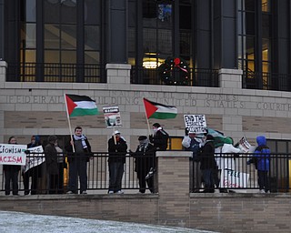 Members of the Arab-American Community Center of Greater Youngstown protest in downtown Youngstown just before the start of First Night Youngstown 2009