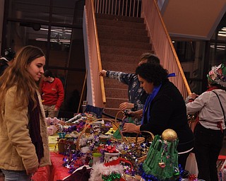 Staff and kids making party hats and noisemakers at the Public Library of Youngstown and Mahoning County as part of First Night Youngstown 2009