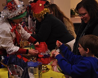 Staff and kids making party hats and noisemakers at the Public Library of Youngstown and Mahoning County as part of First Night Youngstown 2009