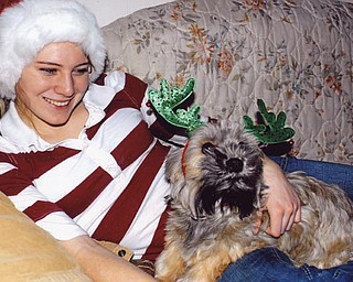 Leanna Hartsough and her dog, Zoey, get in the Christmas spirit. Lana Van Auker of Canfield captured her granddaughter and "grandpup" in action.