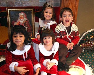 What more can you ask for when 3 4 year olds and a 5 year old "pose" for their Mom "just one more time!"
Photo is of Kate (Age 5) and Carlina, Lily and Patrick (Age 4) Vari-Coppola posing for Holiday Pictures at our house in Lowellville.
Submitted by Mom Jodi