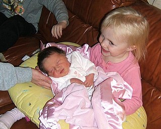 I am sending a picture in response to your joyous occasion feature in
the paper. The photo represents 2 1/2 year old Madison smiling over
her new baby sister Rachel that is 3 days old. The second photo is 4
1/2 year old brother Noah with Madison, Hope these work!
Michelle Snyder