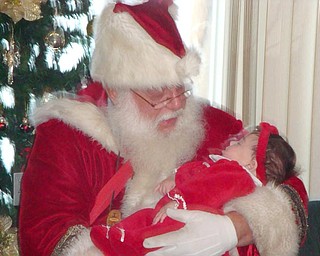 Photo 1 is my 4 month old daughter, Giuliana Maria Cheffo. She was visiting Santa for the first time at her Nonna Annie's house. She has three older brothers, Dominic, Donato, and Francesco. Her dad and I took the picture, Don and Christina Cheffo.
The 2nd photo is of my four children, from left to right, Donato age 4), Giuliana (4 months), Francesco (age 4) and Dominic (age 6). The photo was taken by their parents (Don and Christina Cheffo). We live in Vienna.