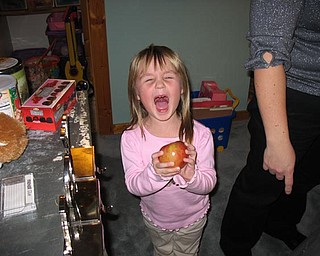 Samantha Moon is three years-old and despite all the gifts she received this year, nothing made her quite so happy as this shiny apple.
I am her aunt, Theresa Moon, and I took the photo on Christmas Eve.