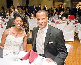 Mayor Jay Williams sits down with his wife, Sonja , during the Mayor's Community Celebration at Stambaugh Auditorium.