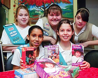 Girl Scouts posing with cookies front l-r Rachael Herns, 10, and Wendy Ford, 11. Back l-r Shelby McIntroy, 12, Breanna Armeni, 13 and Crystal Munoz, 13 They are members of troops 155 and 81 of Campbell.
