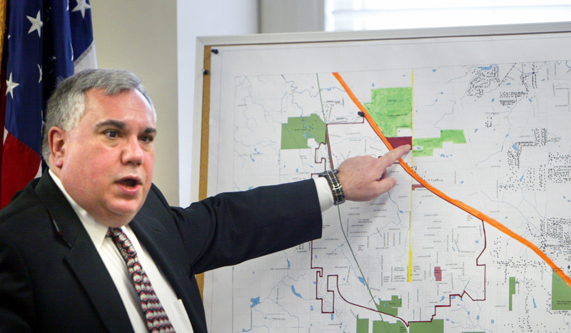 Attorney Al Schrader explains the map of annexation - the orange line is the Ohio Turnpike