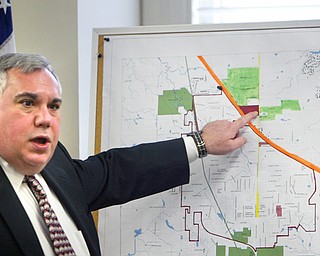 Attorney Al Schrader explains the map of annexation - the orange line is the Ohio Turnpike