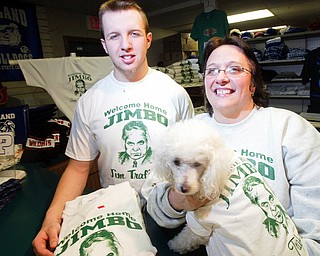 Sherry Trolio-DiVito, owner of Trolio Tshirts in Poland her grandson Jerry Beeson, an employee at the shop, and their dog Noodles sport Welcome Home Jimbo shirts they are selling.
