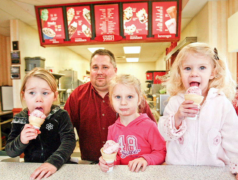 A lick for easter seals - Cameron Posta, 3, Manager of Freindlys in Poland - Tom Collins and sisters Carlie, 3, and Kaylie, 2, Harmon enjoy ice cream cones at Friendlys Ice Cream in Poland