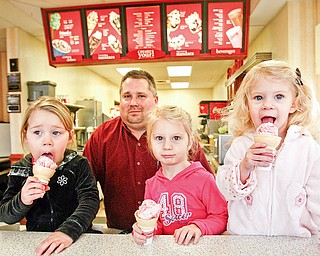 A lick for easter seals - Cameron Posta, 3, Manager of Freindlys in Poland - Tom Collins and sisters Carlie, 3, and Kaylie, 2, Harmon enjoy ice cream cones at Friendlys Ice Cream in Poland