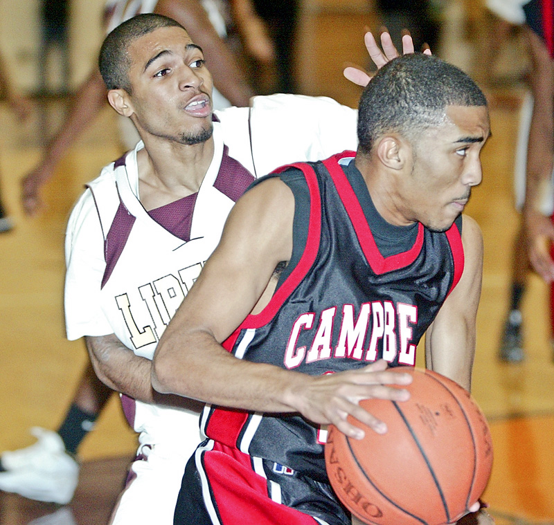 Campbell's Jerah'me Williams drives past Blair Williamks of Liberty