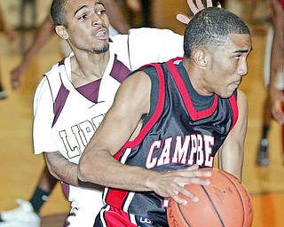 Campbell's Jerah'me Williams drives past Blair Williamks of Liberty