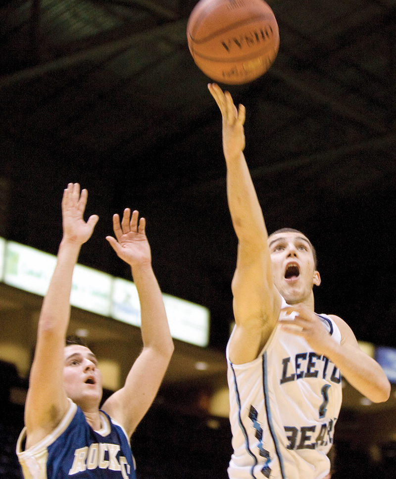 Leetonia's Josh Selway shoots for net past Lowellville's Mike Basista at the the Chevy Centre during a matchup Wednesday evening. Selway went on to score two with the shot.