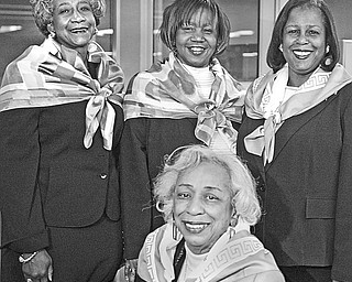 <p>SOMETHING TO SMILE ABOUT: Organizers of the annual Snowflake Ball presented by Epsilon Mu Omega Chapter of Alpha Kappa Alpha Sorority are, seated, Mary Lois Gross, program director and a 50-year member of the chapter, and standing, from left to right, Carole Prestley, decorations; Beverly Fortune, co-chair; and Sandra Smith Graves, co-chair.</p>
