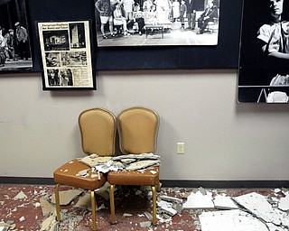 Fallen ceiling tiles and other debris are scattered throughout the Playhouse, which suspended its fall performance lineup due to an ineffective furnace and financial woes. A pipe burst last month, causing water damage throughout the facility.