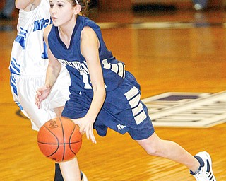 Emily Carson of Lowleville dribbles past Joey Courtney of McDonald.
