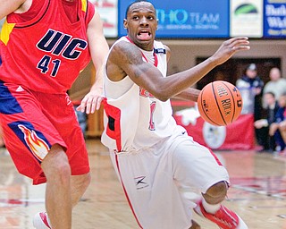 YSU's #1, DeAndre Mays drives down the court past UIC's #41, Scott VanderMeer, during a matchup at YSU's Beeghley Center Thursday night.