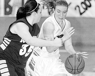 Lindsay Repp of McDonald drives past Chelsie Marrie of Lowellville during 1-8-09 game.
