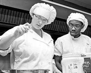 MCCTC students Ashley Bilchik (17) of Campbell and Lamar Jones (20) of Austintown practice their culinary skills in preparation for MCCTC's new Oak Wood Restaurant in Canfield.