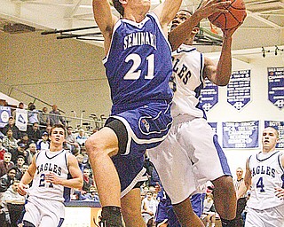 POLAND - HUBBARD - (21) David Baker of poland tries to keep (5) Kurtis Drummond from scoring during their game Friday night in Hubbard.