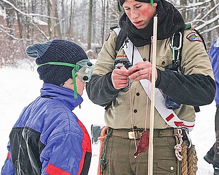 BOY SCOUT - (L) Chris E. and Cody K. make adjustments to their trebuchet Saturday afternoon.