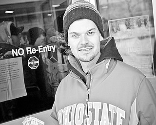 Ray Lewis of Youngstown holds up 6 tickets for the up coming Kelly Pavlik fight. Lewis waited in line at the Chevy Center on Saturday morning during a big snow storm.