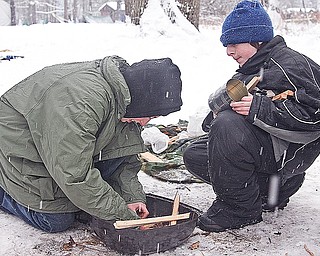BOY SCOUT - (L) Joe L. and Josh D. try to start a fire Saturday afternoon.