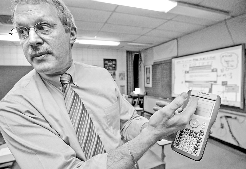 Fitch math teacher Tom Reardon demonstrates use of nspire, a device used in his math class.