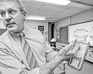 Fitch math teacher Tom Reardon demonstrates use of nspire, a device used in his math class.