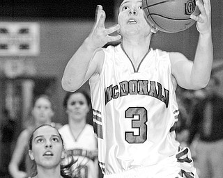 McDonald's Lindsay Repp shoots over Noel Amato of Wellsville during Thursday game at McDonald.