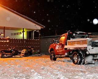 Snowmobiles at the back door of Shevie's Pub in Vienna