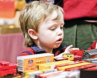 Hadley Reese (3) of Youngstown plays with model trains at McMenamy's Banquet Hall in Niles for the 2009 Winter Flea Market hosted by Youngstown Model Railroad Association
