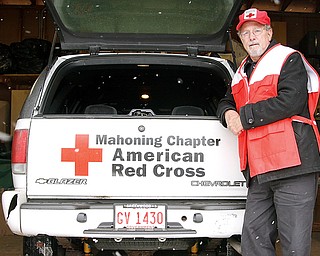 Steve Ilko of Boardman stands beside a Chevrolet Blazer that serves as an emergency relief vehicle.