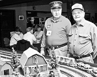 Jim Pope and Ray Lora of Salem stand inside McMenamy's Banquet Hall in Niles for the 2009 Winter Flea Market hosted by Youngstown Model Railroad Association,